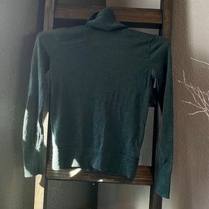 Green turtleneck sweater